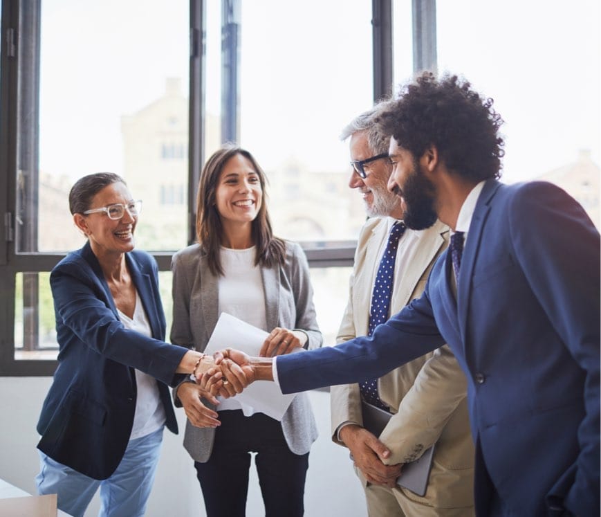 Colleagues shaking one anothers hand