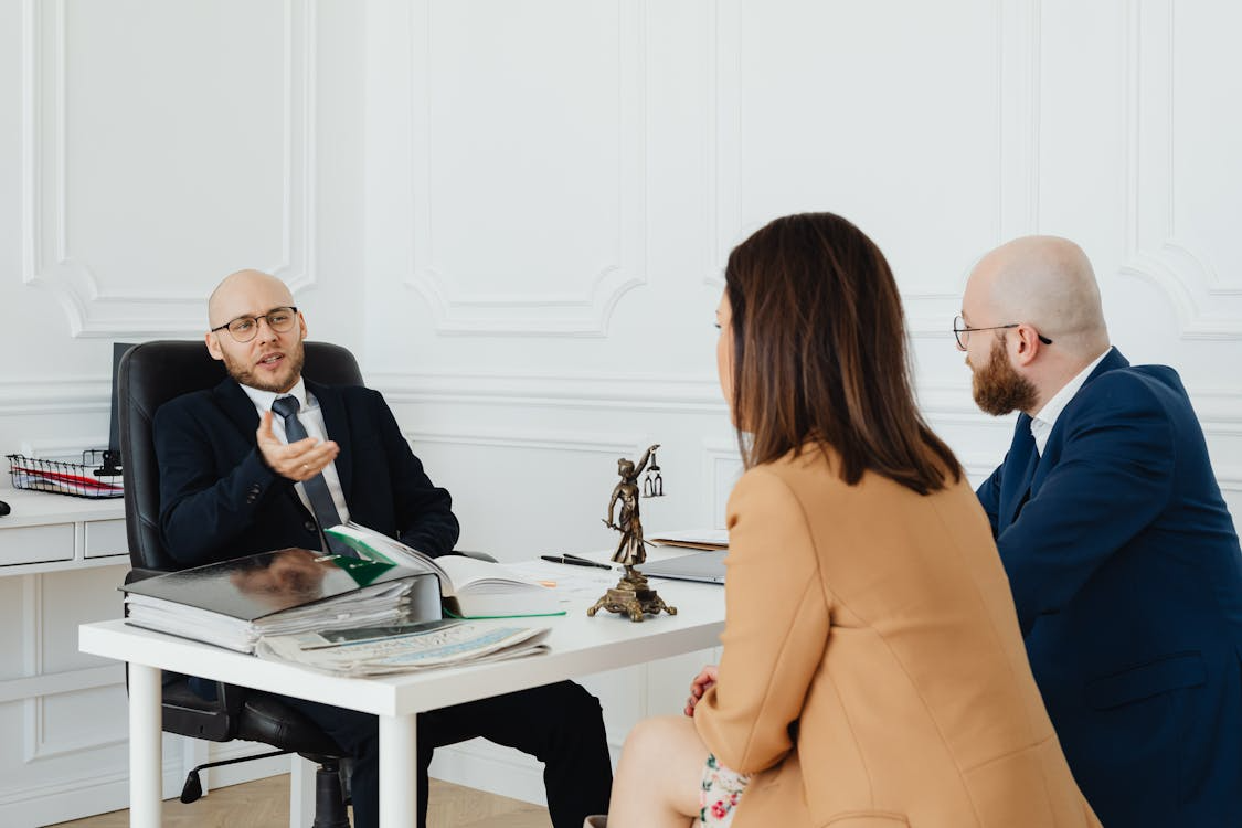 a couple talking to a lawyer